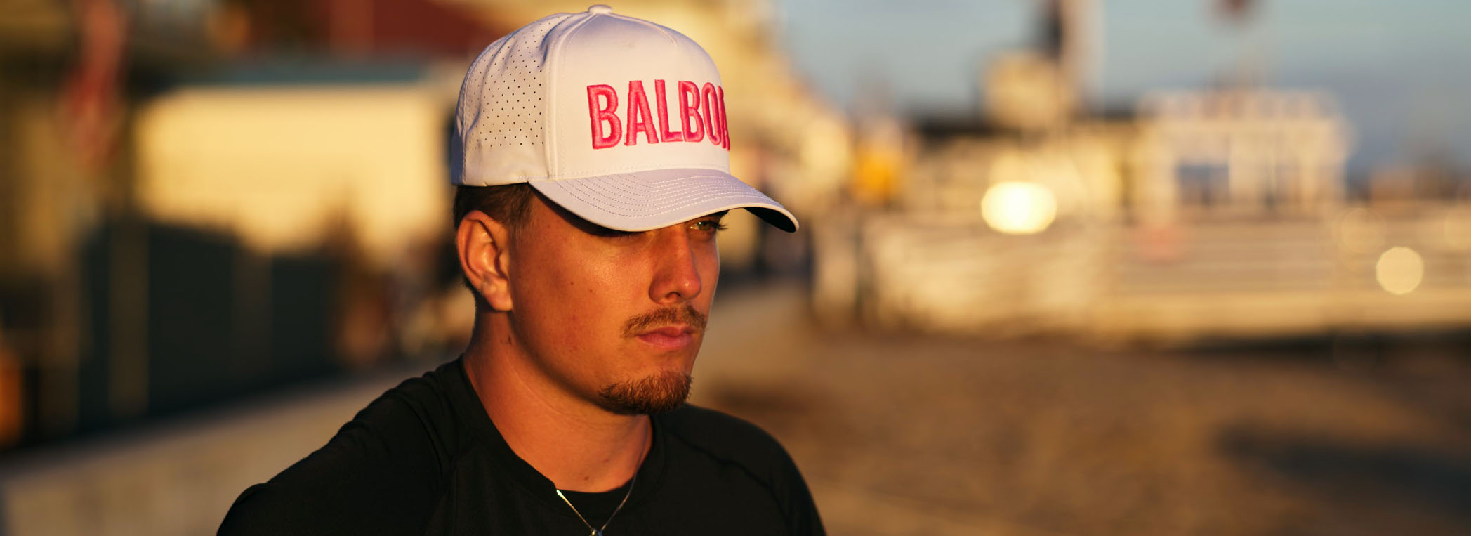 Wearing a Simzies cap on the boardwalk at sunset